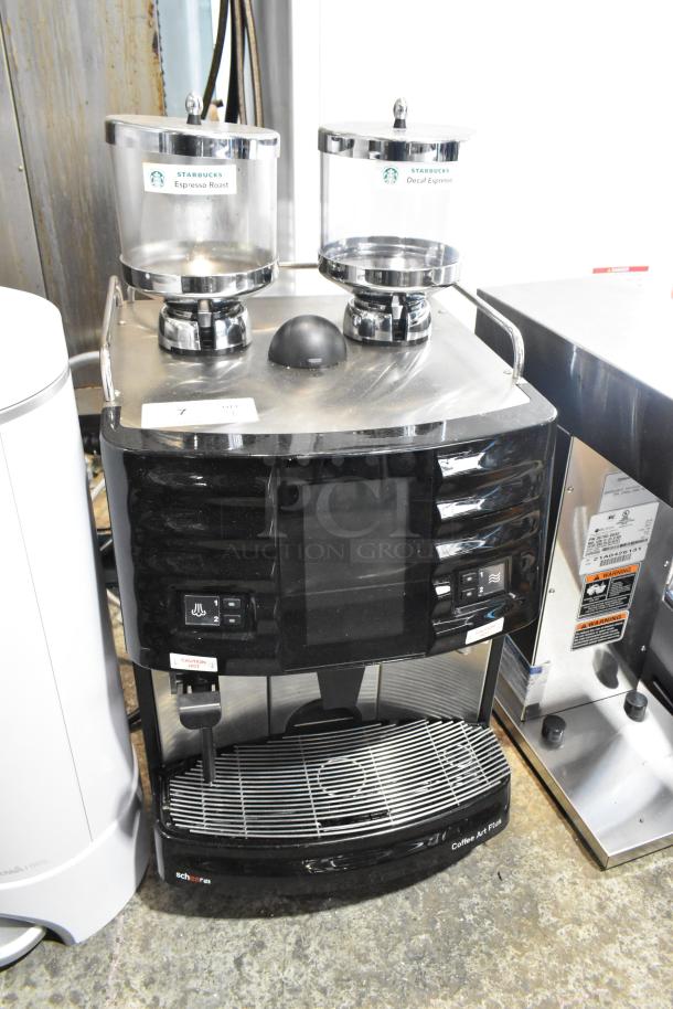 Schaerer Coffee Art Plus espresso machine with dual hoppers, automatic controls, labeled for Starbucks blends, metal finish.