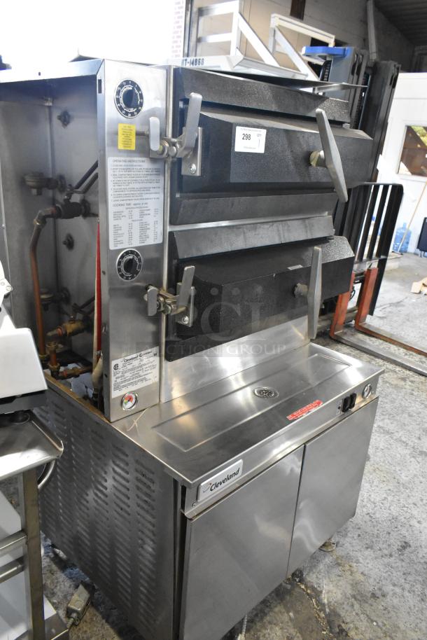 Cleveland PGM3002 stainless steel propane gas 2-deck pressure steam cabinet. Features control dials and operating instructions.