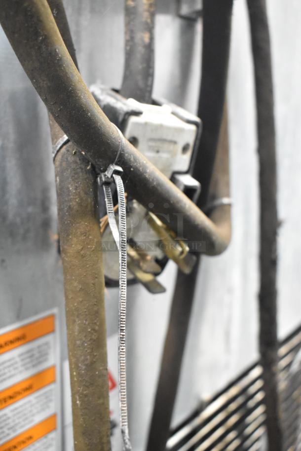 Electrolux AOFS102CU blast chiller, stainless steel, 208V, 3-phase, features visible wiring and warning labels, commercial-grade.