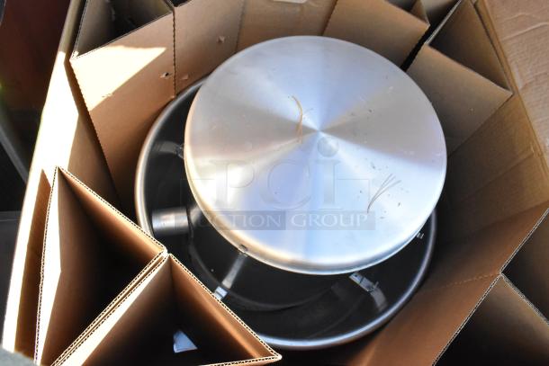 Fantech 5BDU12BB-A metal upblast roof fan in original box, new condition, shows stainless steel finish and protective packaging.