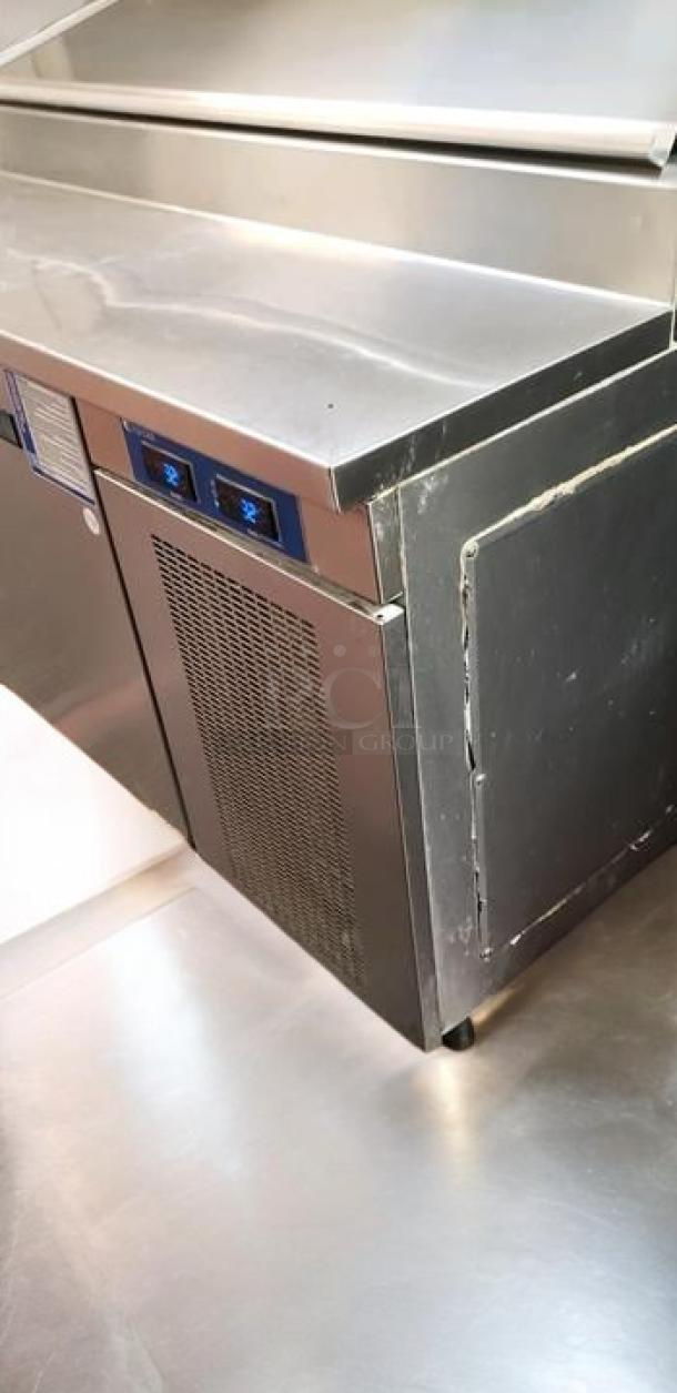 True TPP-93D-4 refrigerated pizza prep table, 93", 3-door with drawers, 115V, stainless steel, tested and in great condition.