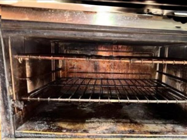 Southbend 4601DD gas range oven interior, showing racks and used condition. Features 10 burners and 2 ovens. Tested and working.