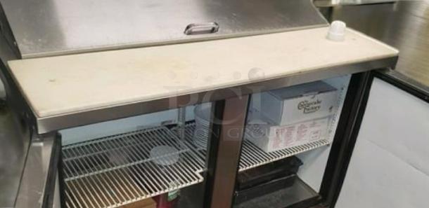 True TSSU-48-12 prep refrigerator, excellent condition, 2 doors, 48" wide, shelves visible, fully tested, 115V, stainless steel.