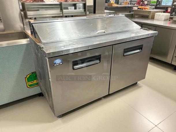 Blue Air BAPT60 60″ prep table in great condition, stainless steel, tested and working, with dual doors and Blue Air logo.