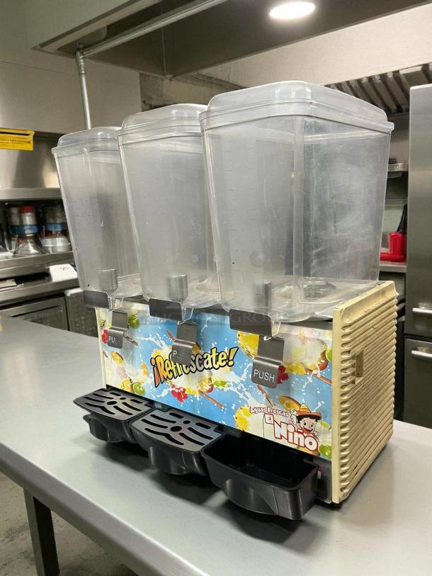 Crathco D35-4 Classic Bubbler beverage dispenser, tested and working, with three clear compartments. Features “¡Refrescate!” graphics.