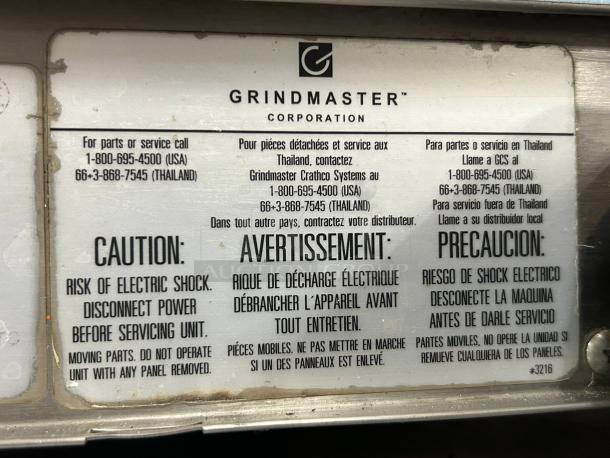 Label on Crathco D35-4 Grindmaster Classic Bubbler. Caution warnings and service contact info visible.
