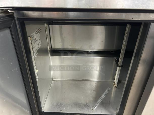True TWT-72-HC 19 Cu.Ft Stainless Steel 3-Section Work Top Refrigerator, great condition, interior view, model label visible.
