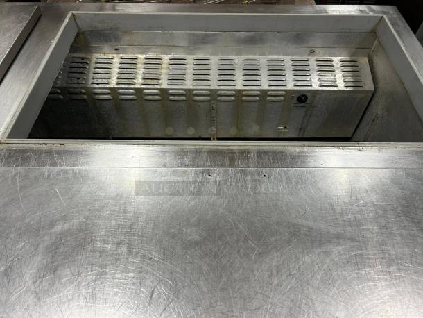 Continental SW72-N-30M 72" 3-door sandwich prep table, excellent condition, stainless surface, interior view, tested working.