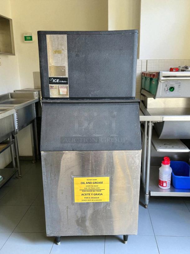 Ice-O-Matic ICE0500HW ice machine, great condition, tested working; front label shows brand. Yellow warning sign on front.