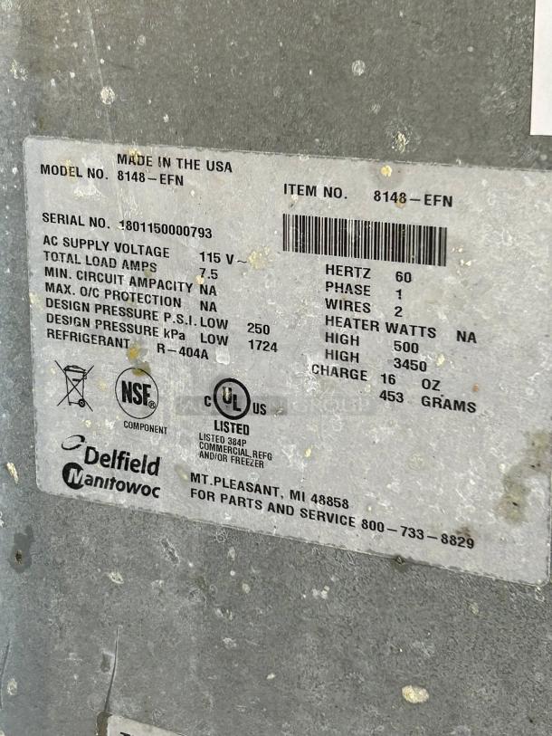 Delfield 8148-EFNP tag displaying model, serial number, voltage, and certifications, important for verifying specs and condition.