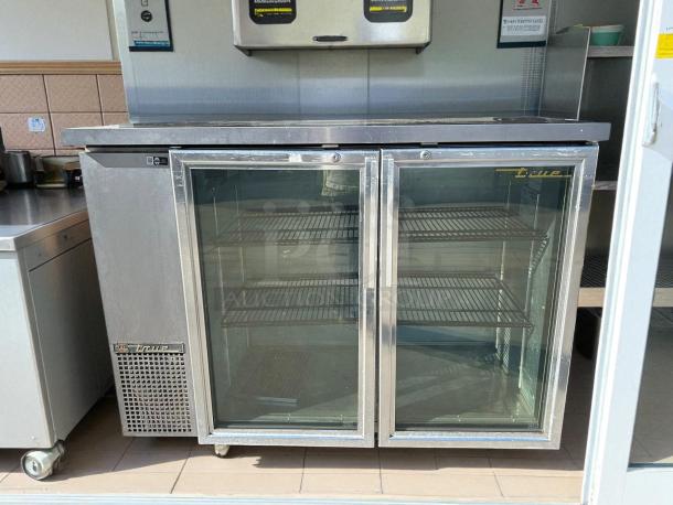 True TBB-24-48G-HC-LD 49" glass-door back bar cooler in excellent condition, stainless steel, tested and working.