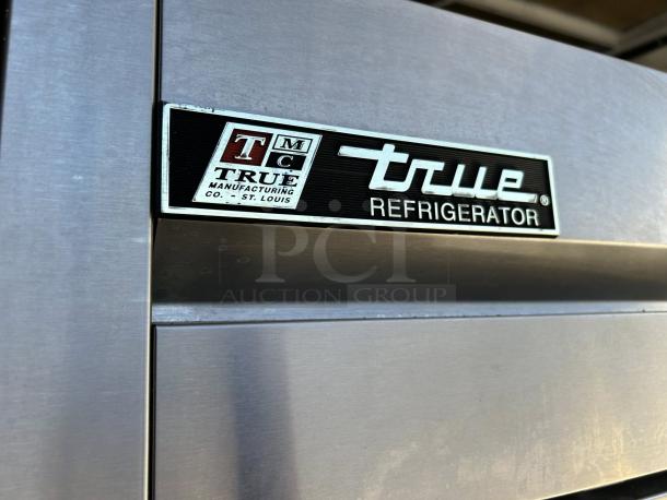 True T-49-HC reach-in refrigerator, stainless steel, solid door, tested, working. Model label visible, made in St. Louis.