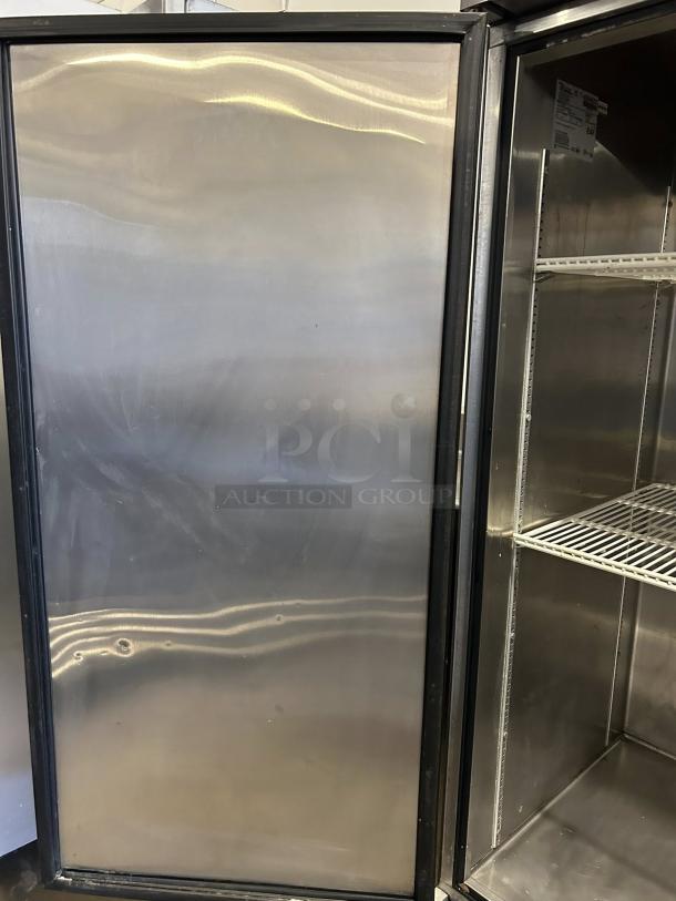 True TS-49-HC 54" 2-section reach-in refrigerator, stainless steel, tested and working. Visible shelves and interior label. Great condition.