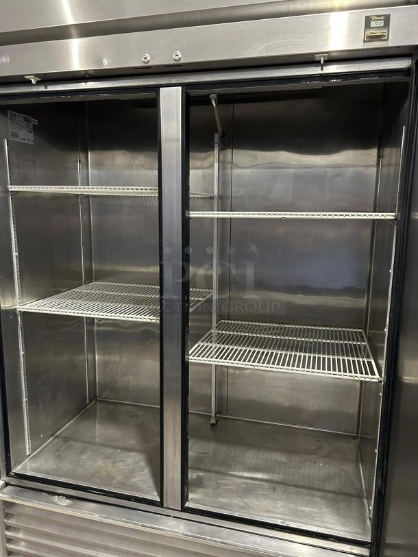 True TS-49-HC 54" reach-in refrigerator; stainless steel, dual-section, glass doors, shelves intact, tested and working.