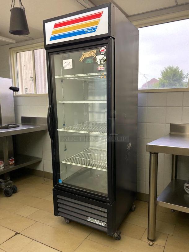 True GDM-23-HC~TSL01 27" black refrigerated glass door merchandiser, left-hinged, tested, working, excellent condition.