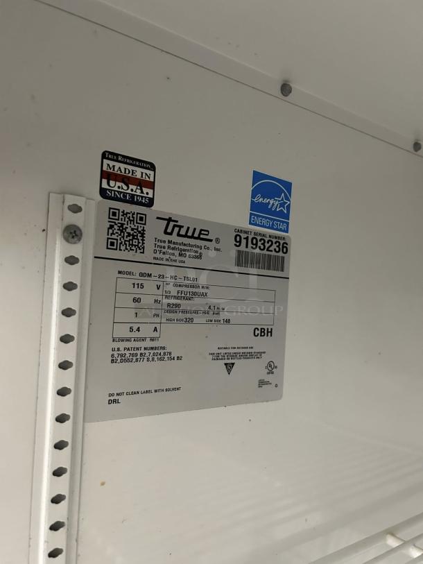 True GDM-23-HC~TSL01 27" black refrigerated merchandiser, left-hinged glass door, tested and working, Energy Star label.