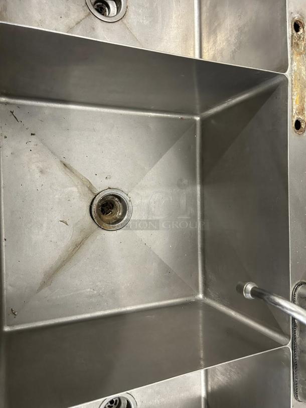 All stainless steel 3-compartment bakery sink with 22"x22" basins, heavy-duty gauge, tested and working, visible wear.