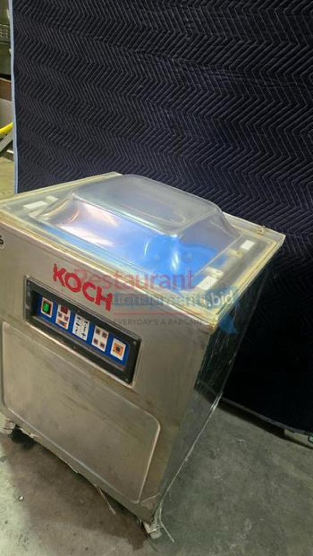 Koch K918-3 heavy-duty chamber vacuum sealer in superb condition. Features a clear lid, control panel, and 220V power. Made in Germany.