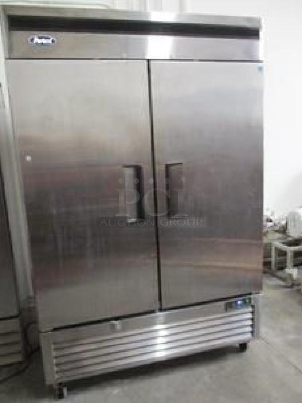 Alt text: "Atosa MBF8507GR 54-inch two-section reach-in refrigerator with solid doors, excellent condition, fully tested and working."