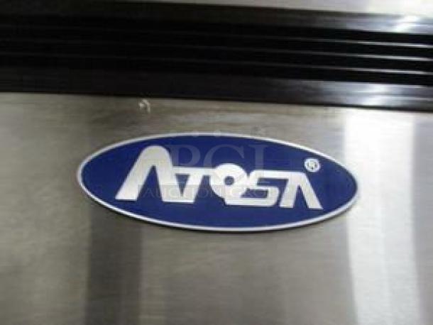 Atosa USA logo on stainless steel, part of the Atosa MBF8507GR, 54" reach-in refrigerator in excellent condition.