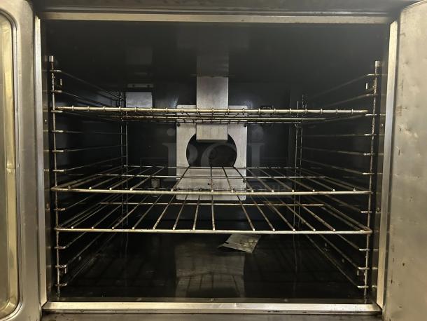 Imperial Range PCVG-1 convection oven, excellent condition, natural gas, two-speed motor, inside view, shelves visible.