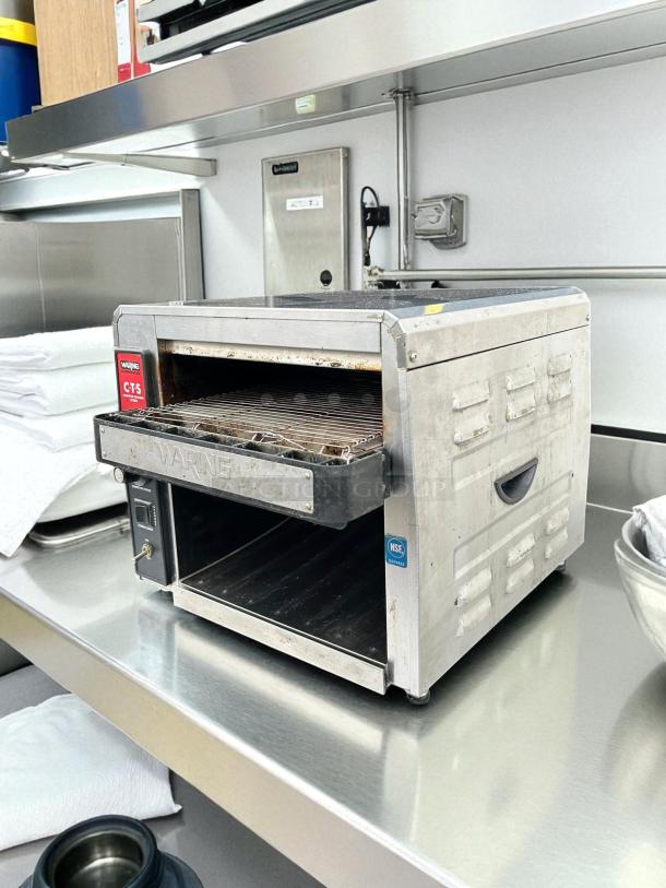 Waring CTS1000 commercial conveyor toaster in excellent condition, 120V, tested and working; NSF certified label visible.