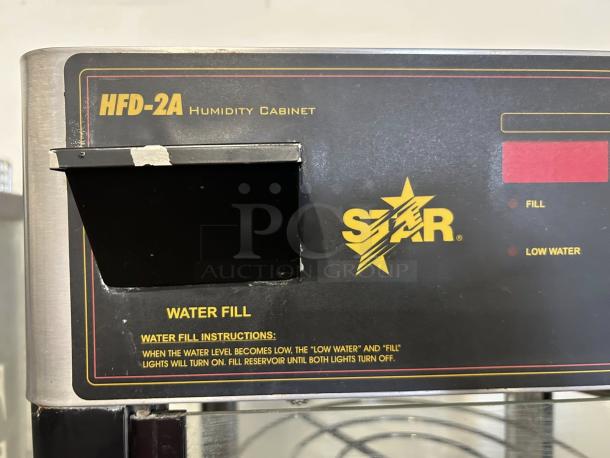 Star Mfg HFD-2A countertop heated display case with humidity control, visible branding, and water fill instructions.