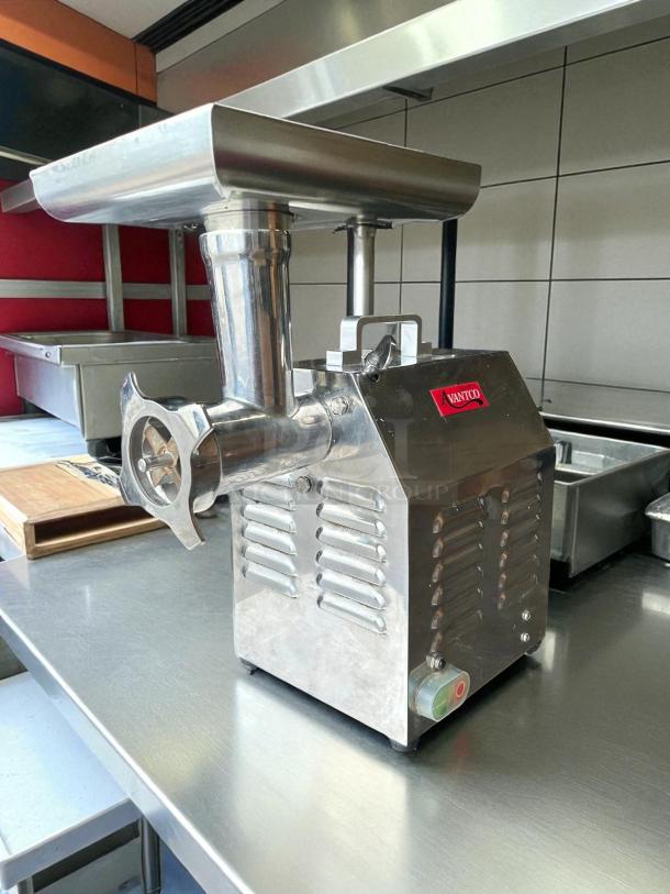 Avantco MG12R #12 Meat Grinder, 110V, 1 hp, stainless steel, tested and working, visible Avantco logo, reverse setting.