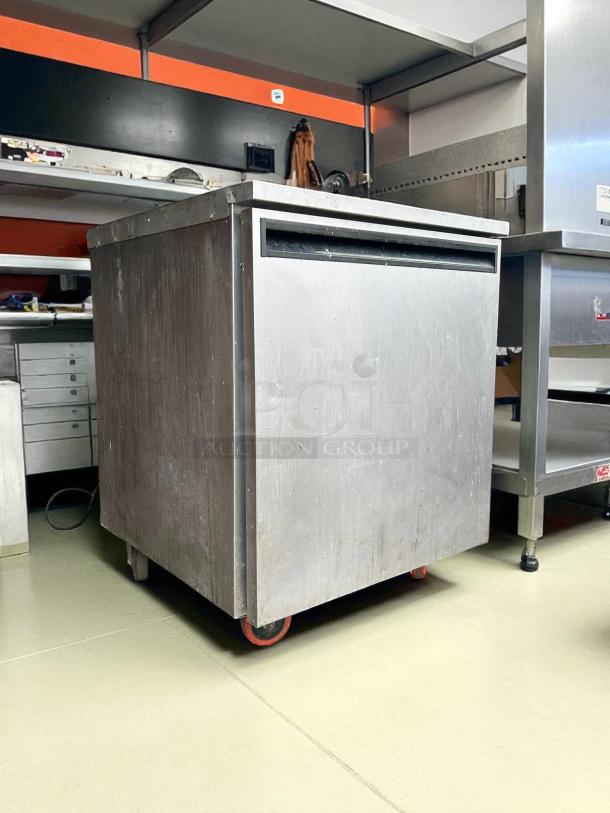 Delfield 407-CAP undercounter freezer, 27.25"W, stainless steel, excellent condition, tested, on casters for mobility.