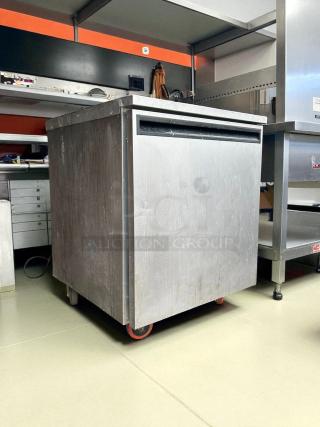 Delfield 407-CAP undercounter freezer, 27.25"W, stainless steel, excellent condition, tested, on casters for mobility.