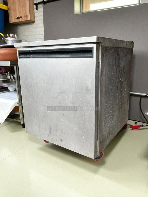 Delfield 407-CAP undercounter freezer, 27.25"W, excellent condition, stainless steel, tested and working, on casters.
