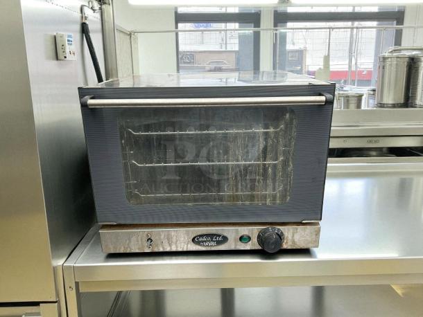 Cadco OV-250 commercial convection oven, quarter size, electric. Stainless steel, great condition, tested and working.