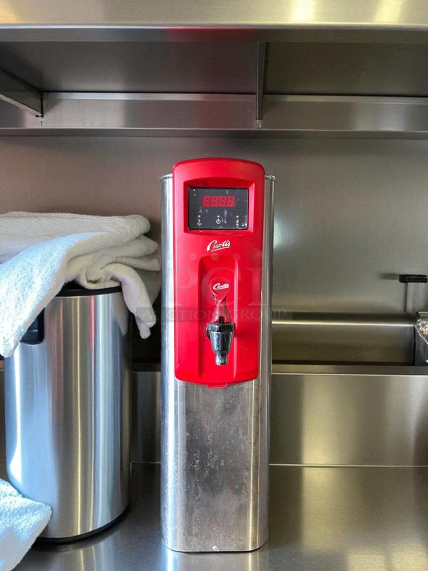 Curtis WB5N hot water dispenser, 5-gal capacity, 120-220v/1ph, excellent condition, tested and working, red front panel.