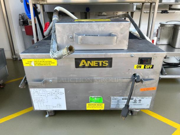 Anets FFM80 commercial fryer filter, 80 lb capacity, gravity-fed, 120v, tested, working. On/off switch, caution labels visible.