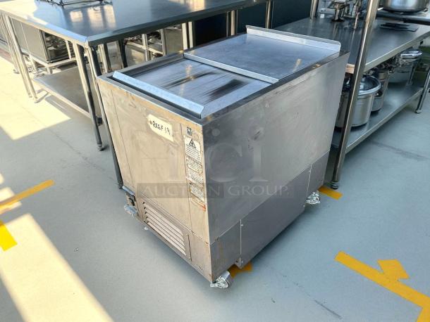 H & K International 34" stainless steel meat freezer, propane-powered, excellent condition, tested, and working.