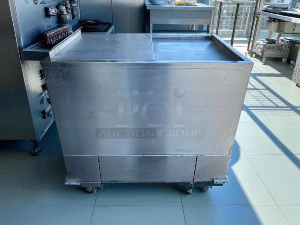 H & K International 34" stainless steel meat freezer, propane-powered, excellent condition, tested and working.
