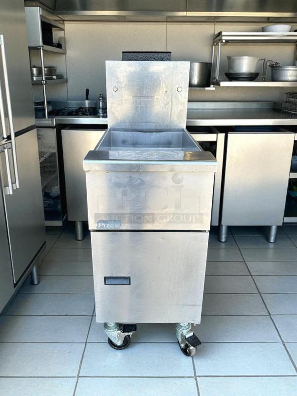 Pitco VF-35S gas fryer, excellent condition, 35 lb vat, floor model, natural gas, tested, on wheels, stainless steel finish.