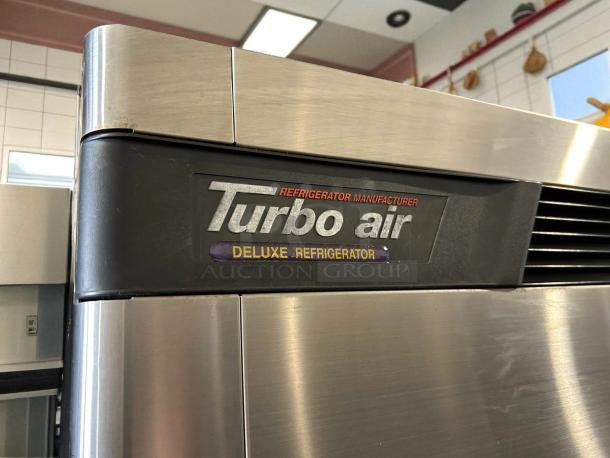 Turbo Air TSR-72SD-N reach-in fridge, stainless steel, excellent condition, branded "Deluxe Refrigerator," tested working.