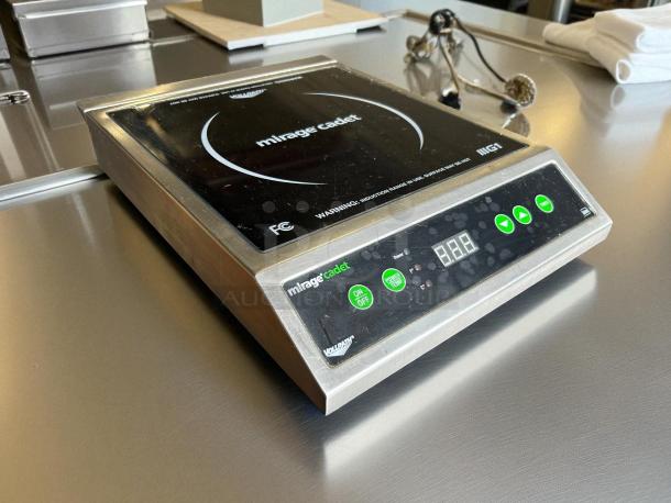 Vollrath 59300 Mirage Cadet 12"x16" induction range in great condition. Features digital display and control buttons.