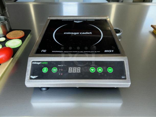 Vollrath 59300 Mirage Cadet induction range, 12"x16", 1800W, tested and working. Features digital controls, sleek design.