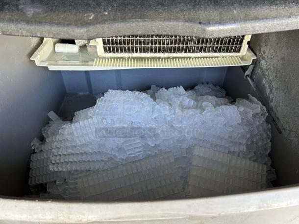 Ice-O-Matic ICEU300FA 30" undercounter ice machine in excellent condition, showing full dice cube ice production.