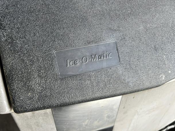 Ice-O-Matic ICEU300FA ice machine, excellent condition, black textured surface with brand label. Air cooled, 30" wide.