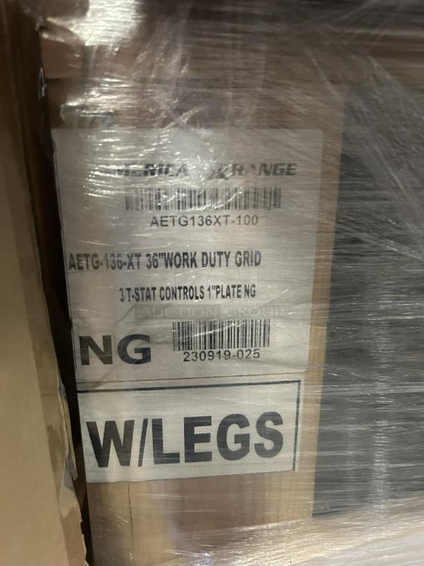 Brand new American Range ARTG-136 36" gas griddle with 3 burners, model AETG136XT-100. Box shows tag indicating "work duty grid" and "W/LEGS."
