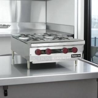 Brand new Therma-Tek TCHP24-4 burner countertop gas hotplate with controls, stainless steel, unused condition.