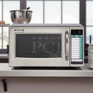 Sharp R-22GTF heavy-duty commercial microwave oven, 1200 watts, 120V. Stainless steel exterior, keypad control, excellent condition.