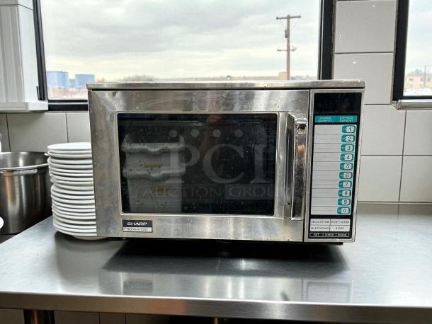 Sharp R-22GTF commercial microwave, 1200W, stainless steel, tested, keypad controls, visible label reads 1600W/R-23GT.