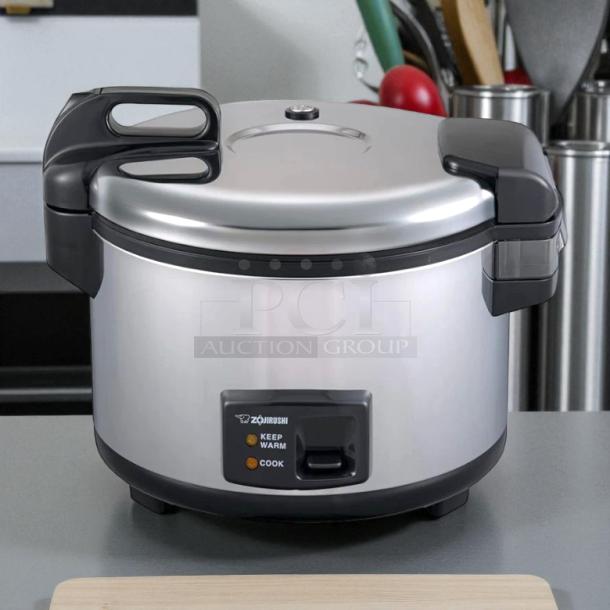 Zojirushi NYC-36 20-cup electric rice cooker in stainless steel. Tested and working. Features keep warm and cook settings.