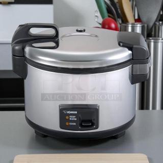 Zojirushi NYC-36 20-cup electric rice cooker in stainless steel. Tested and working. Features keep warm and cook settings.