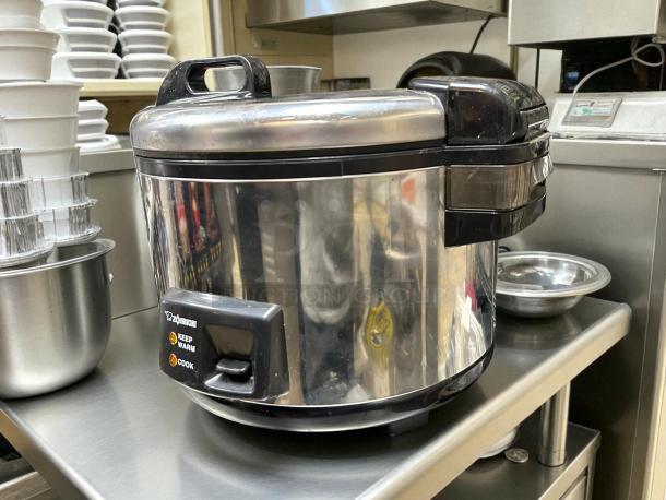 Zojirushi NYC-36 20-cup electric rice cooker in stainless steel, tested and working, on a kitchen counter.
