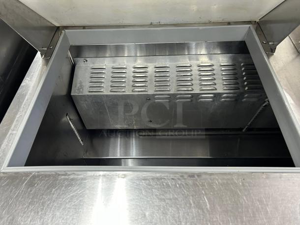 Continental Refrigerator SW60-N-18M 60" 2 Door Sandwich Prep Table interior, stainless steel, excellent condition.